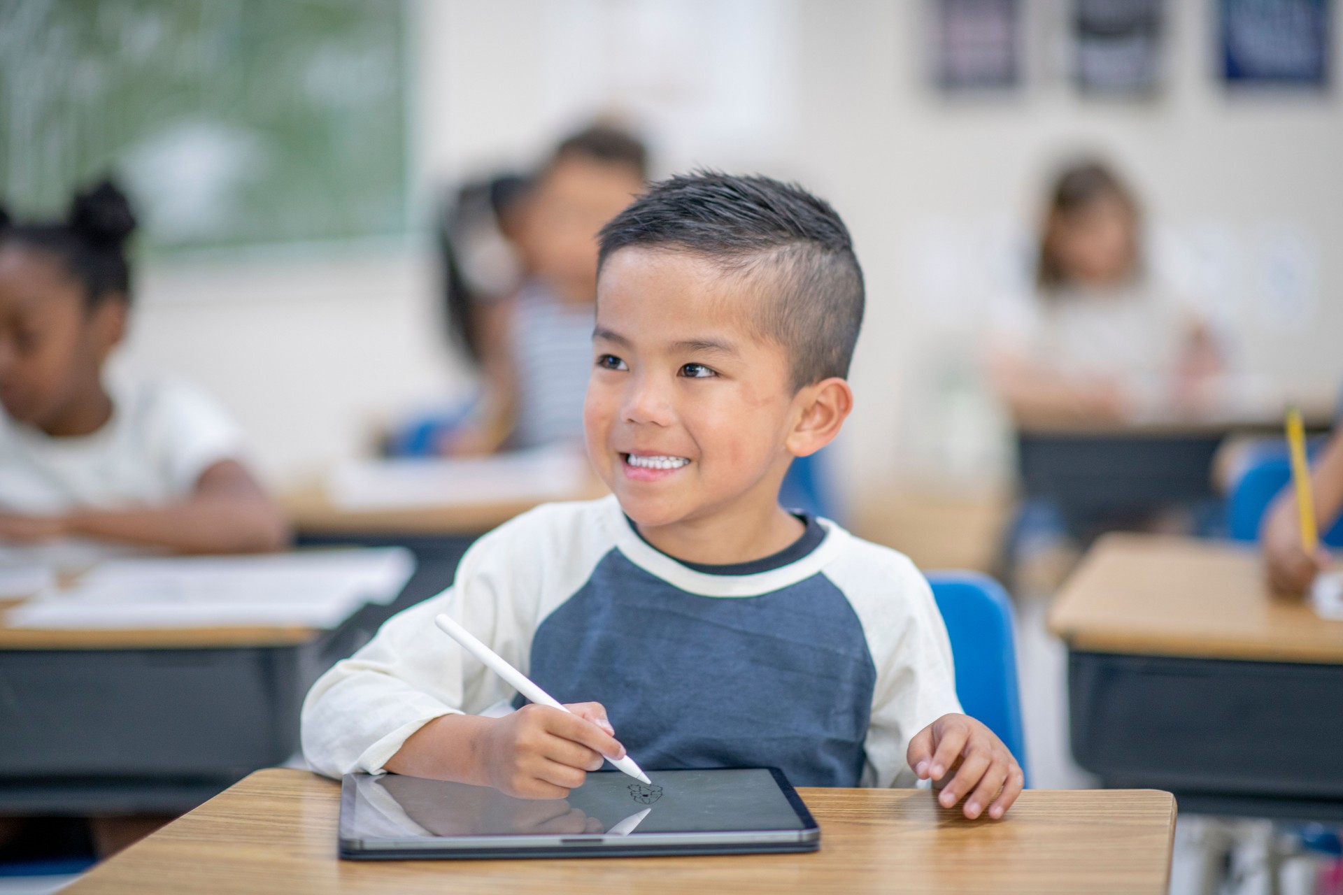 Elementary Boy Working on a Tablet stock photo
